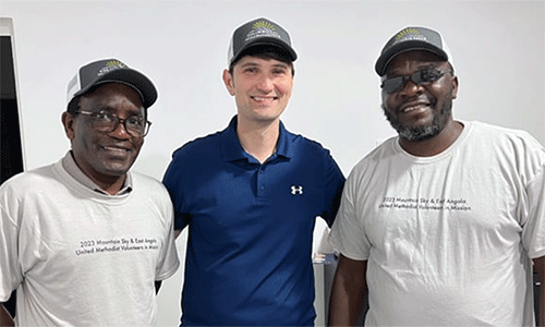 A partnership between the Mountain Sky Conference and East Angola is celebrating 20 years. “There are natural connections of taking care of the land, growing your own food, caring for community,” said the Rev. Jared Stine, pastor of Columbia Falls United Methodist Church in Columbia Falls, Mont., and a member of the team that visited in July. Pictured from left are missionary Ken Koome, Stine and missionary Kutela Katembo. The Mountain Sky Conference supports the work of Koome and Katembo in East Angola. Photo courtesy of the Rev. Jared Stine.